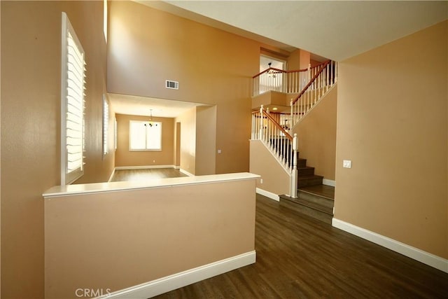 29429 Masters Dr, Murrieta, CA 92563 - foyer entrance featuring dark wood-type flooring, baseboards, and stairs