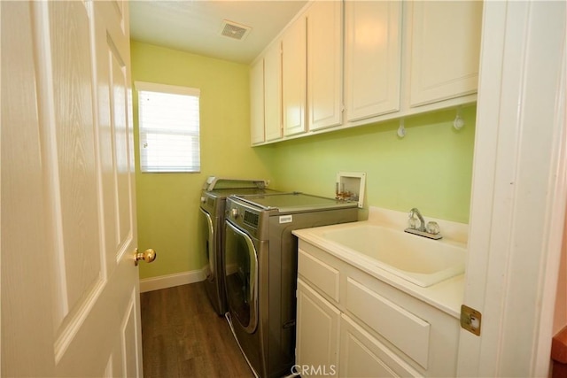 29429 Masters Dr, Murrieta, CA 92563 - washroom with separate washer and dryer, cabinet space, dark wood-style floors, and baseboards
