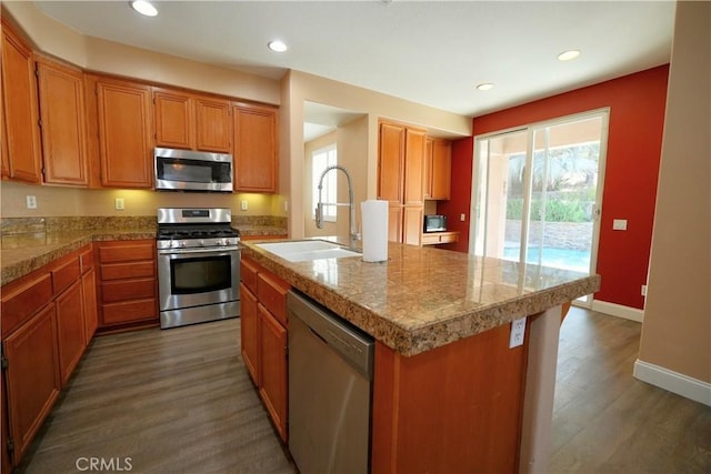 29429 Masters Dr, Murrieta, CA 92563 - kitchen featuring appliances with stainless steel finishes, a sink, tile counters, healthy amount of natural light, and recessed lighting