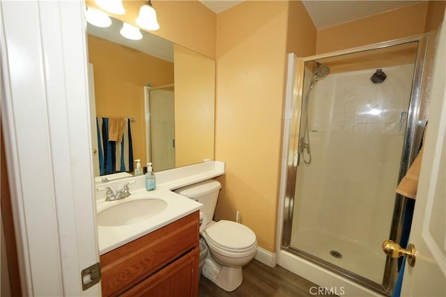 29429 Masters Dr, Murrieta, CA 92563 - bathroom with toilet, a stall shower, vanity, and wood finished floors