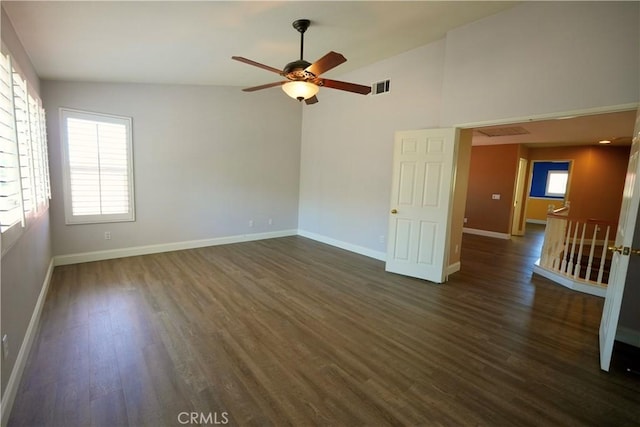 29429 Masters Dr, Murrieta, CA 92563 - spare room with dark wood-type flooring, a ceiling fan, baseboards, and high vaulted ceiling