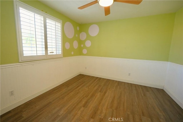 29429 Masters Dr, Murrieta, CA 92563 - spare room with a wainscoted wall, wood finished floors, and a ceiling fan