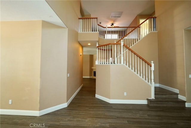 29429 Masters Dr, Murrieta, CA 92563 - foyer with wood finished floors, baseboards, stairway, and a high ceiling