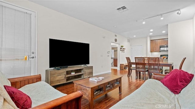2123 Scholarship, Irvine, CA 92612 - living area with wood finished floors, recessed lighting, rail lighting, and baseboards