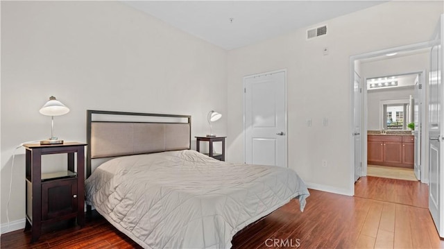 2123 Scholarship, Irvine, CA 92612 - bedroom featuring hardwood / wood-style floors, baseboards, and connected bathroom