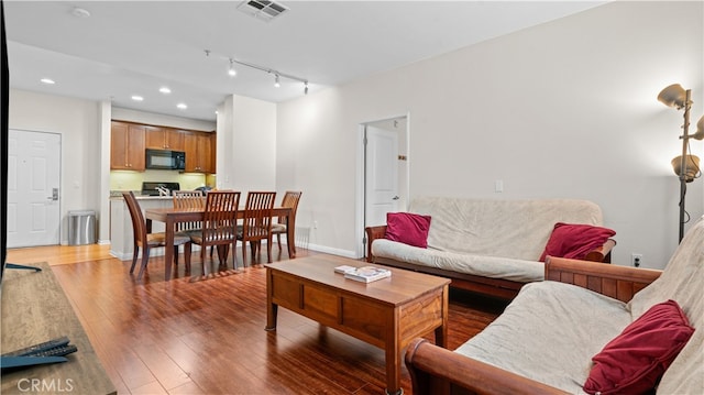 2123 Scholarship, Irvine, CA 92612 - living area with light wood-style flooring, recessed lighting, baseboards, and rail lighting