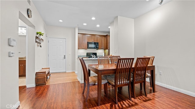 2123 Scholarship, Irvine, CA 92612 - dining space with wood finished floors and recessed lighting