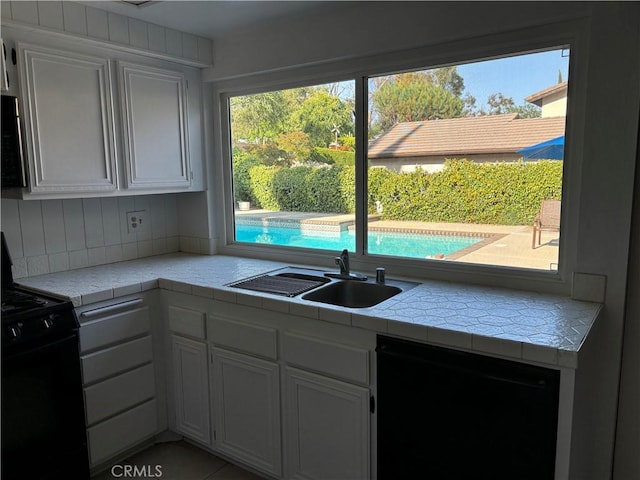 7950 Gardenia, Rancho Cucamonga, CA 91701 - kitchen featuring black appliances, a sink, tile countertops, and white cabinetry