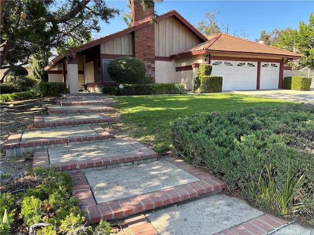 7950 Gardenia, Rancho Cucamonga, CA 91701 - view of front of home with a chimney, board and batten siding, a front yard, a garage, and driveway