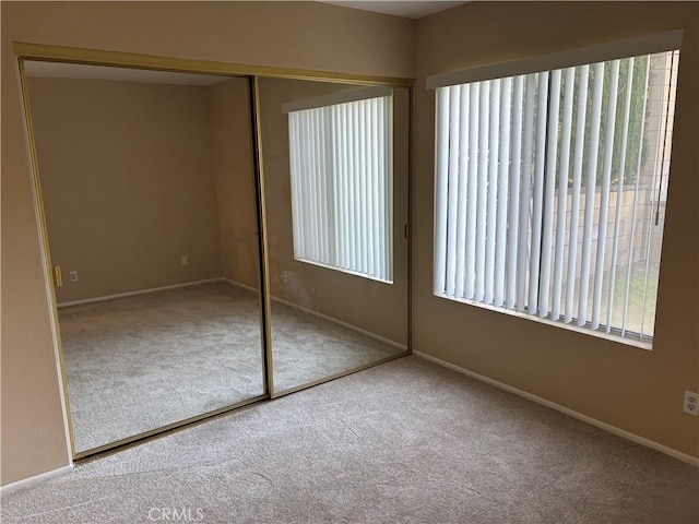 7950 Gardenia, Rancho Cucamonga, CA 91701 - unfurnished bedroom with carpet floors, multiple windows, and a closet