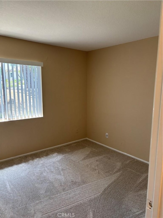 7950 Gardenia, Rancho Cucamonga, CA 91701 - spare room with carpet, a textured ceiling, and baseboards