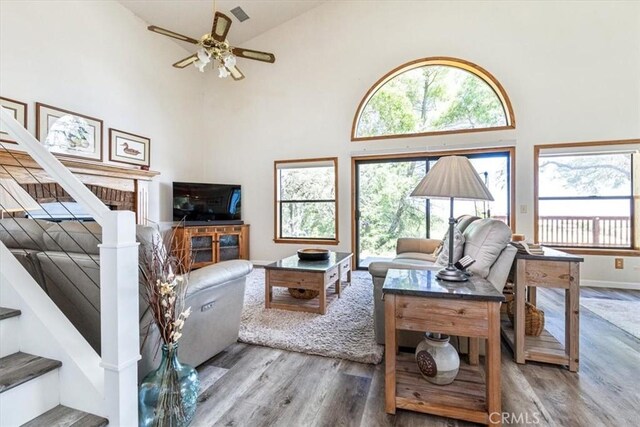 12355 Santa Ana Rd, Atascadero, CA 93422 - living area featuring high vaulted ceiling, wood finished floors, plenty of natural light, ceiling fan, and baseboards