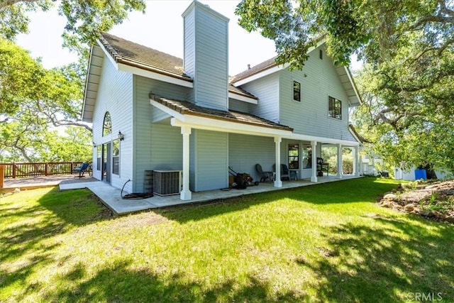 12355 Santa Ana Rd, Atascadero, CA 93422 - back of property with a chimney, a lawn, a patio, and cooling unit