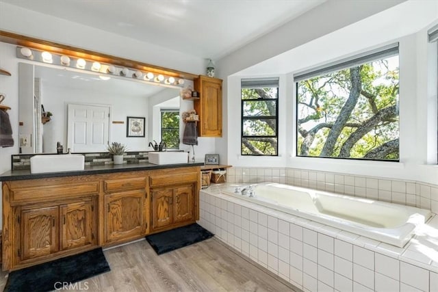 12355 Santa Ana Rd, Atascadero, CA 93422 - full bath with a bath, double vanity, and wood finished floors