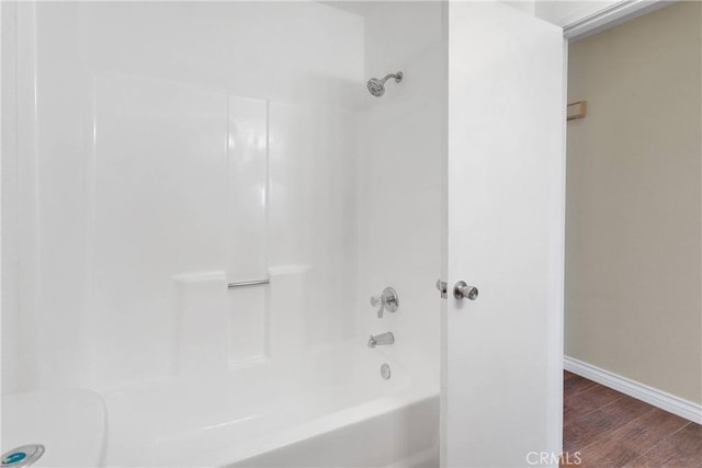 19002 Vine St, Hesperia, CA 92345 - full bath with wood finished floors, baseboards, bathtub / shower combination, and toilet