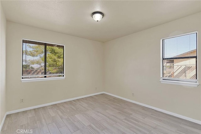 19002 Vine St, Hesperia, CA 92345 - empty room featuring light wood finished floors and baseboards