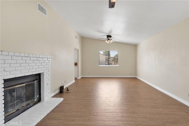 19002 Vine St, Hesperia, CA 92345 - unfurnished living room featuring ceiling fan, wood finished floors, a fireplace, and baseboards
