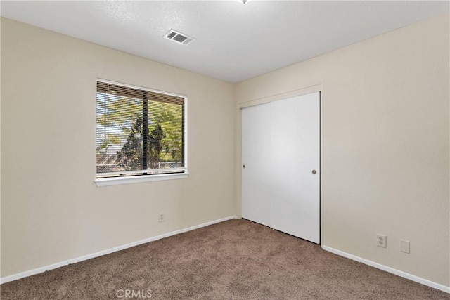 19002 Vine St, Hesperia, CA 92345 - unfurnished bedroom featuring carpet flooring, baseboards, and a closet