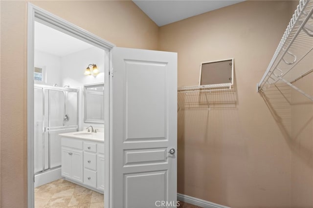 211 Furyk Way, Hemet, CA 92545 - bathroom featuring a shower stall, vanity, and a walk in closet