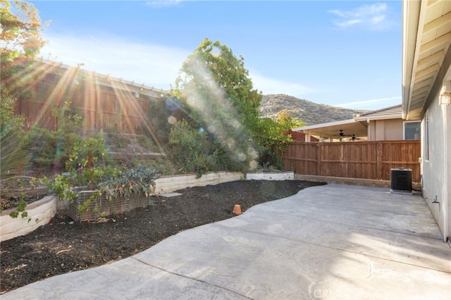 211 Furyk Way, Hemet, CA 92545 - fenced backyard with a patio, central AC unit, and a mountain view