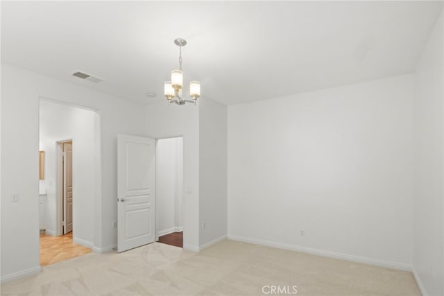 211 Furyk Way, Hemet, CA 92545 - spare room featuring light colored carpet and a chandelier