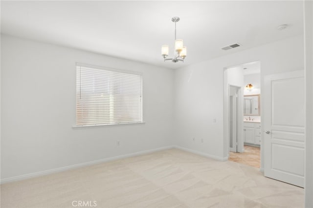 211 Furyk Way, Hemet, CA 92545 - unfurnished room featuring a chandelier and light colored carpet