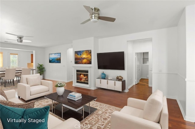 211 Furyk Way, Hemet, CA 92545 - living room with ceiling fan, wood finished floors, a glass covered fireplace, and baseboards