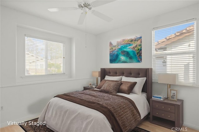 211 Furyk Way, Hemet, CA 92545 - bedroom featuring multiple windows, wood finished floors, baseboards, and a ceiling fan