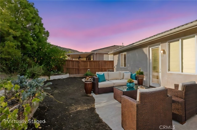211 Furyk Way, Hemet, CA 92545 - patio terrace at dusk featuring an outdoor hangout area and a patio area