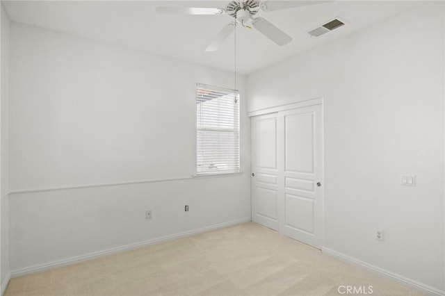 211 Furyk Way, Hemet, CA 92545 - unfurnished bedroom featuring light carpet, baseboards, a closet, and ceiling fan