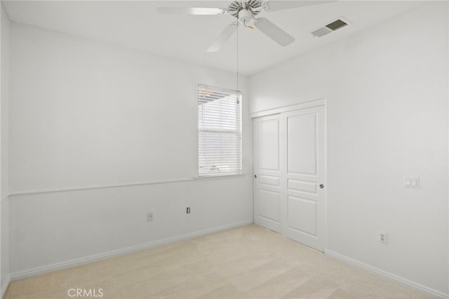 211 Furyk Way, Hemet, CA 92545 - unfurnished bedroom featuring light colored carpet, a closet, and ceiling fan