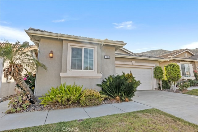 211 Furyk Way, Hemet, CA 92545 - view of front facade featuring an attached garage, stucco siding, and concrete driveway