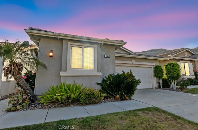 211 Furyk Way, Hemet, CA 92545 - view of front facade featuring stucco siding, a garage, and concrete driveway