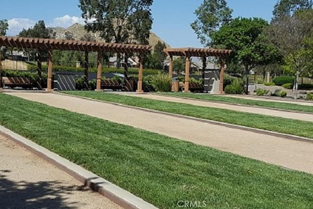 211 Furyk Way, Hemet, CA 92545 - surrounding community with a pergola, a yard, and a game area
