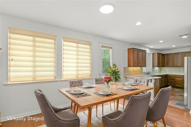 211 Furyk Way, Hemet, CA 92545 - dining room with light wood-type flooring, baseboards, and recessed lighting