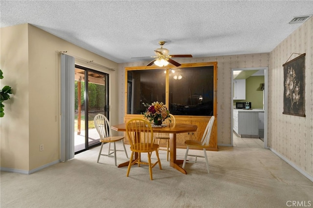 2380 Peppertree Ln, Riverside, CA 92506 - dining space featuring wallpapered walls, ceiling fan, baseboards, carpet floors, and a textured ceiling