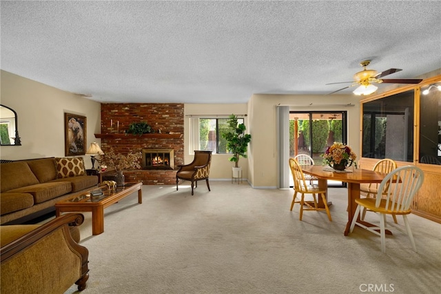 2380 Peppertree Ln, Riverside, CA 92506 - carpeted living area featuring a textured ceiling, a fireplace, a ceiling fan, and baseboards