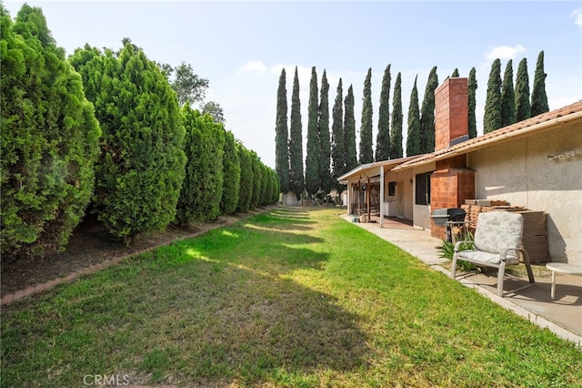 2380 Peppertree Ln, Riverside, CA 92506 - view of grassy yard featuring a patio area