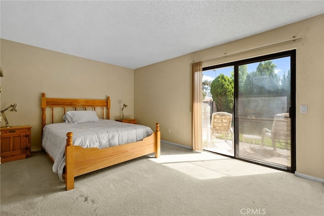 2380 Peppertree Ln, Riverside, CA 92506 - carpeted bedroom featuring access to exterior, a textured ceiling, and baseboards