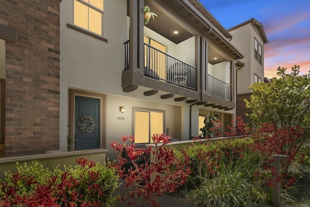 1836 Mesquite, Oceanside, CA 92056 - back of property at dusk featuring a balcony and stucco siding