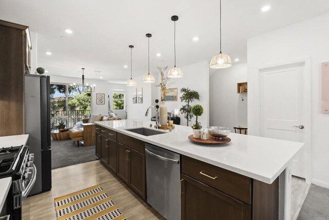 1836 Mesquite, Oceanside, CA 92056 - kitchen with stainless steel appliances, a sink, open floor plan, dark brown cabinetry, and recessed lighting