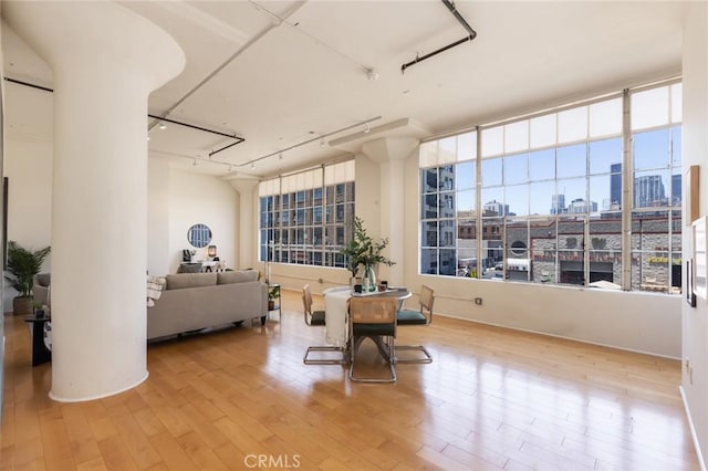 420 S San Pedro St Unit 211, Los Angeles, CA 90013 - dining space with a view of city and wood finished floors