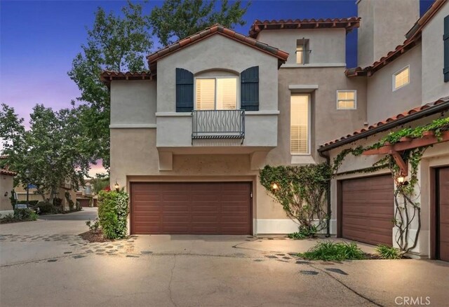 1 Sorrento Ct, Newport Coast, CA 92657 - mediterranean / spanish-style house with a garage, stucco siding, driveway, and a tiled roof
