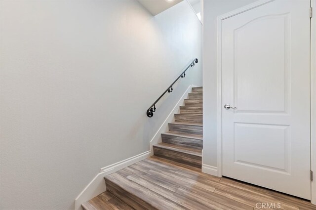 1 Sorrento Ct, Newport Coast, CA 92657 - staircase featuring wood finished floors and baseboards