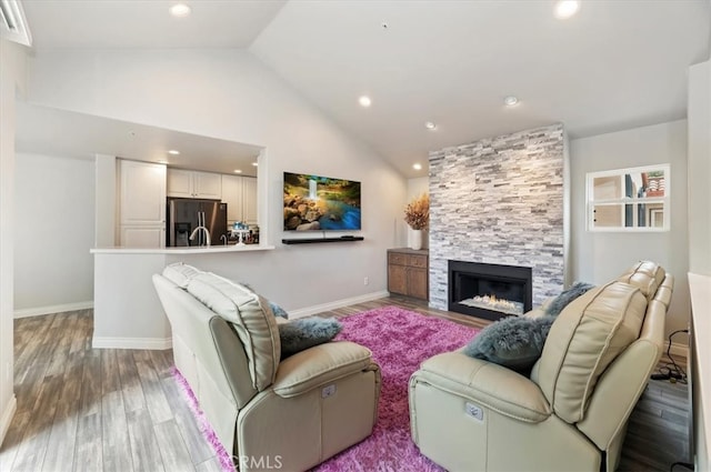 1 Sorrento Ct, Newport Coast, CA 92657 - living room featuring lofted ceiling, wood finished floors, a fireplace, baseboards, and recessed lighting
