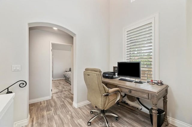 1 Sorrento Ct, Newport Coast, CA 92657 - office area featuring arched walkways, light wood-type flooring, and baseboards