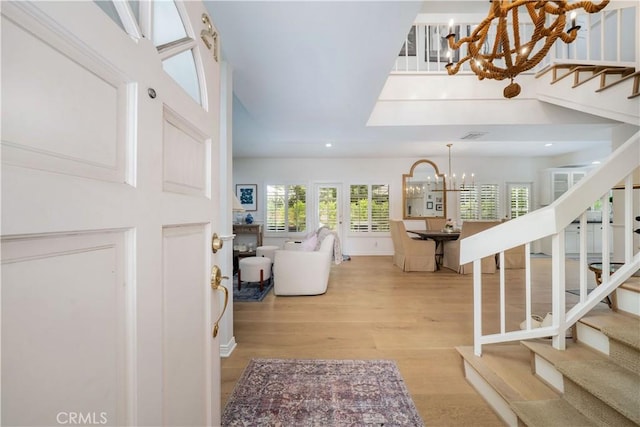5200 White Oak Ave Unit 21, Encino, CA 91316 - entryway with a chandelier, stairway, wood finished floors, and recessed lighting
