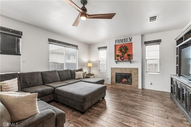 3568 Rock Butte Pl, Perris, CA 92570 - living room with ceiling fan, wood finished floors, healthy amount of natural light, and a fireplace