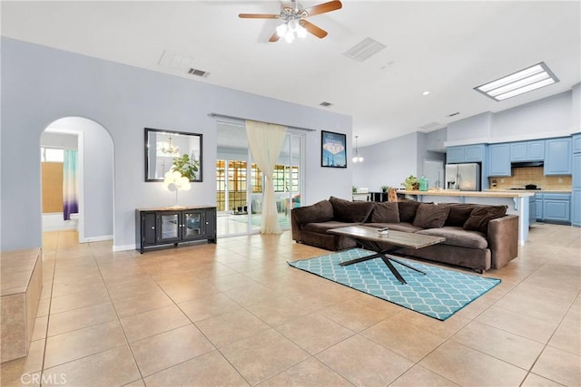 1679 Desert Front Rd, Wrightwood, CA 92397 - living area featuring vaulted ceiling, light tile patterned floors, arched walkways, and a ceiling fan