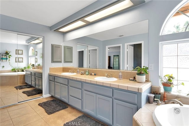 1679 Desert Front Rd, Wrightwood, CA 92397 - bathroom with double vanity, a garden tub, and tile patterned floors